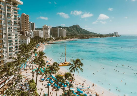 Oahu shoreline with sandy beach and buildings along the coast