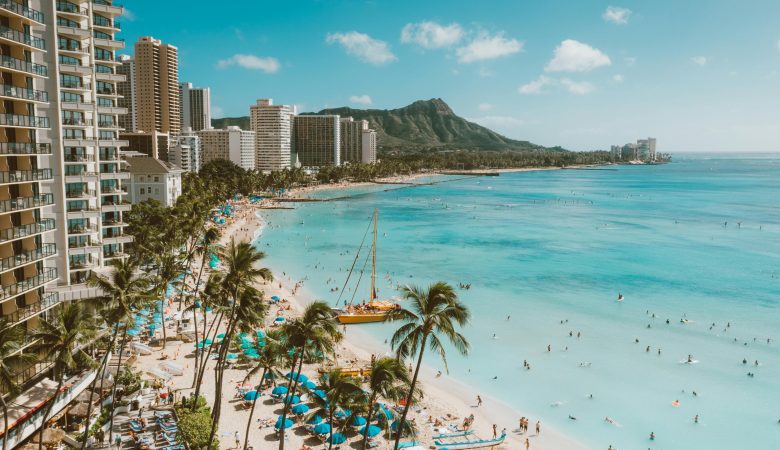 Oahu shoreline with sandy beach and buildings along the coast
